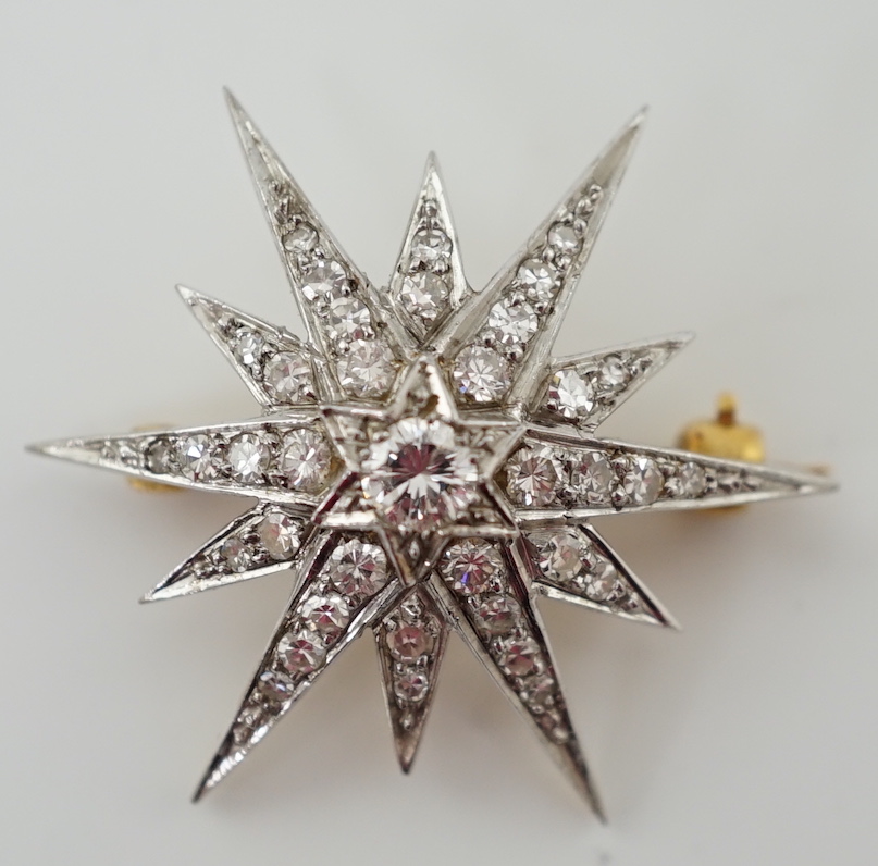 An Edwardian gold and diamond cluster set starburst brooch